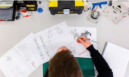 Woman making engineering drawings